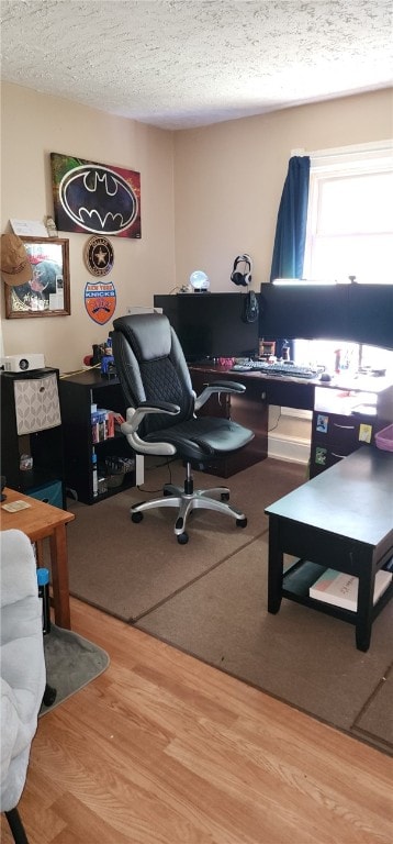 office area featuring a textured ceiling and wood finished floors