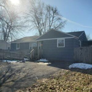 rear view of house with fence