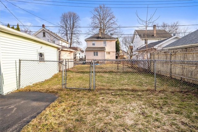 view of yard with a gate and fence