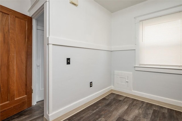 laundry room featuring dark wood-type flooring, baseboards, and electric dryer hookup