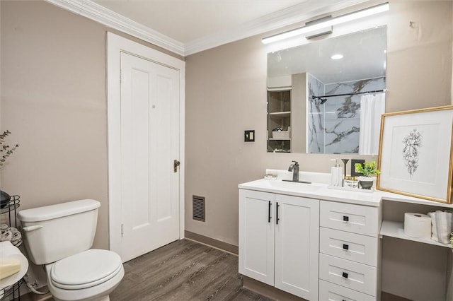 bathroom with visible vents, curtained shower, toilet, ornamental molding, and wood finished floors