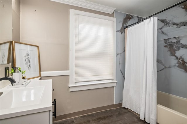 full bath with shower / tub combo, wood finished floors, and vanity