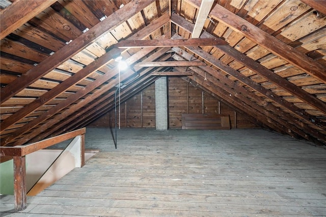 attic featuring an upstairs landing