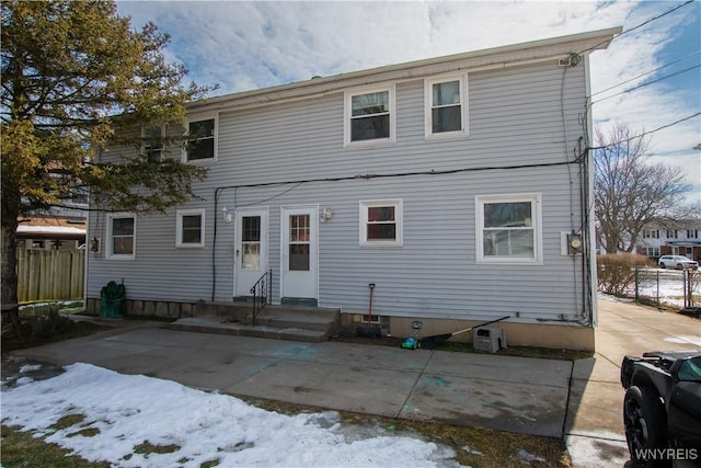 rear view of house featuring entry steps