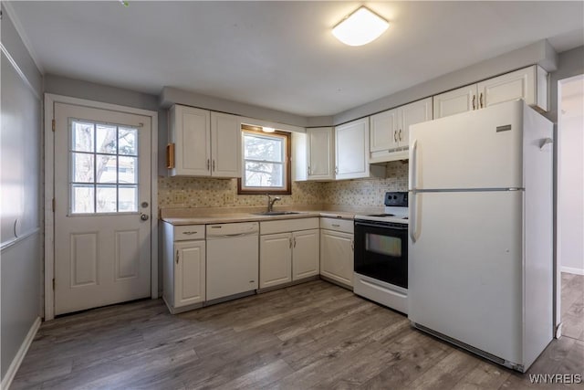 kitchen with white cabinetry, white appliances, wood finished floors, and light countertops