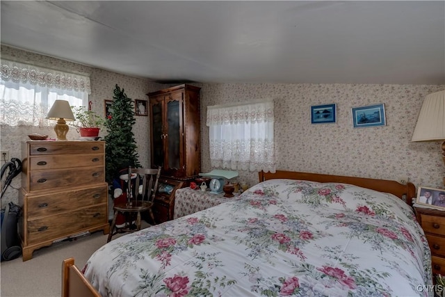 carpeted bedroom featuring wallpapered walls