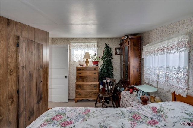 bedroom featuring wallpapered walls