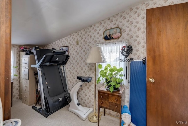 exercise area with wallpapered walls and carpet flooring