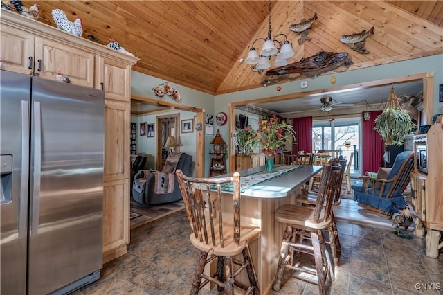 dining room with ceiling fan, stone finish flooring, high vaulted ceiling, and wooden ceiling