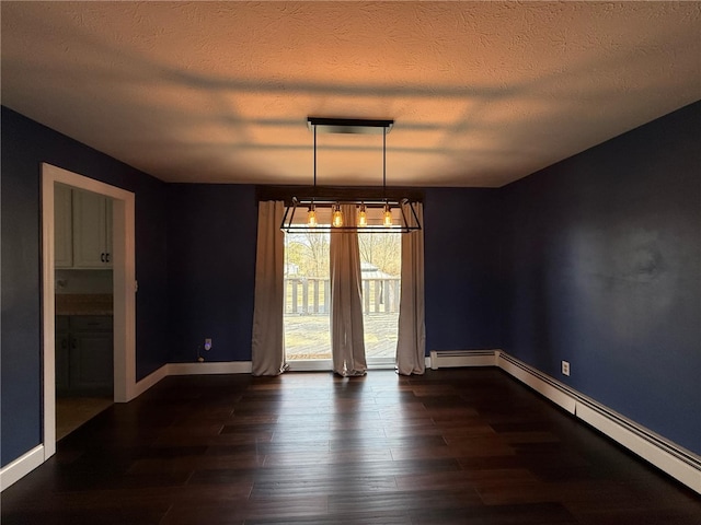 spare room with dark wood-style floors, a textured ceiling, baseboards, and a baseboard radiator