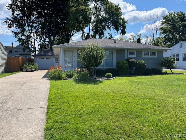 single story home featuring a front lawn, an attached garage, driveway, and fence