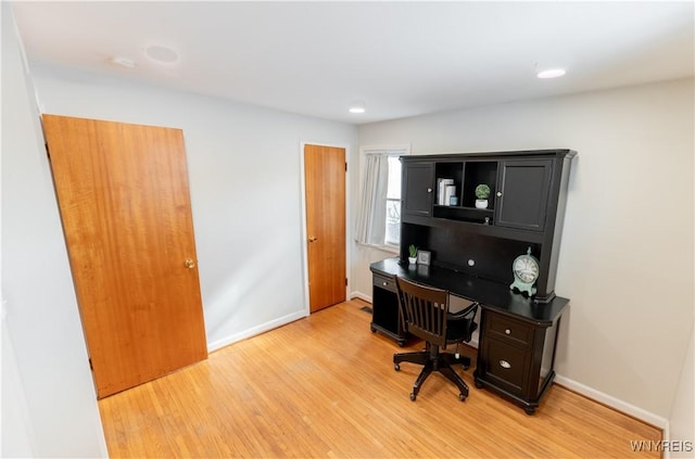 office featuring light wood-style flooring, recessed lighting, and baseboards