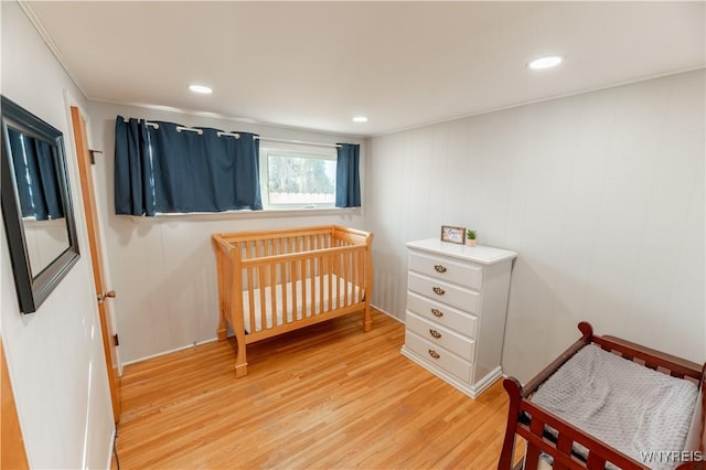 bedroom with recessed lighting and light wood-style floors