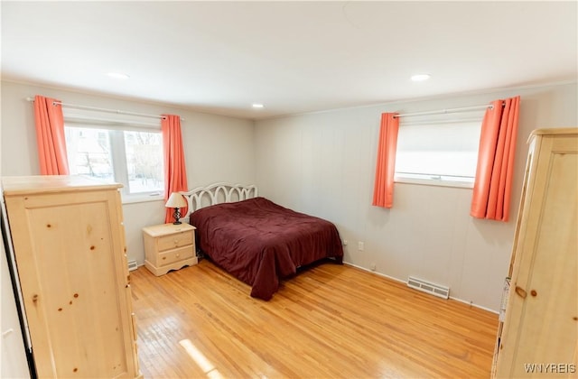 bedroom with recessed lighting, light wood-style floors, and visible vents