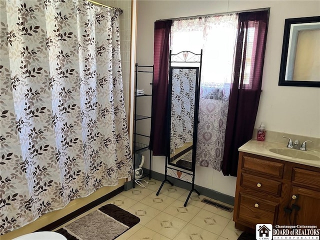 full bath featuring visible vents, toilet, vanity, and tile patterned flooring