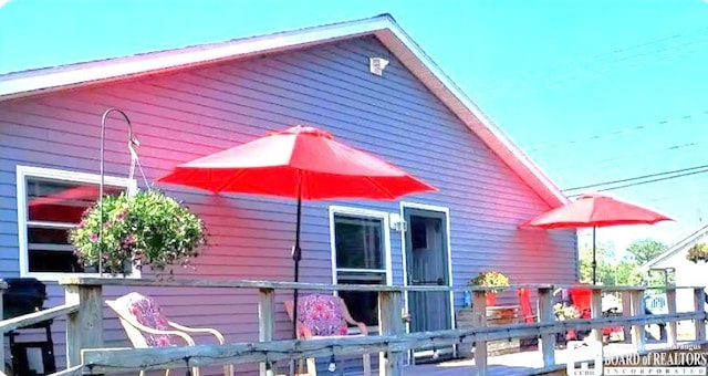 view of side of property with fence