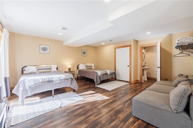 bedroom with visible vents, recessed lighting, baseboards, and wood finished floors