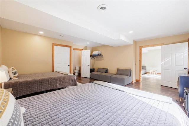 bedroom with visible vents, recessed lighting, baseboards, and wood finished floors