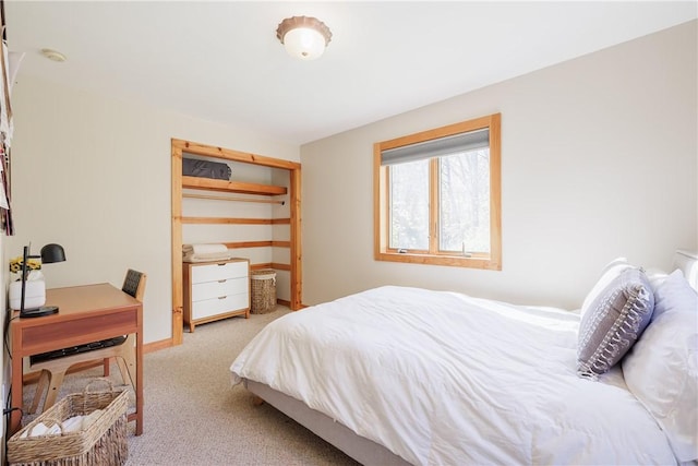 bedroom featuring carpet and baseboards