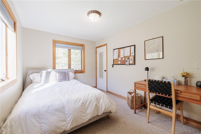 carpeted bedroom with baseboards