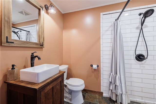 full bathroom featuring visible vents, tiled shower, stone finish flooring, crown molding, and toilet