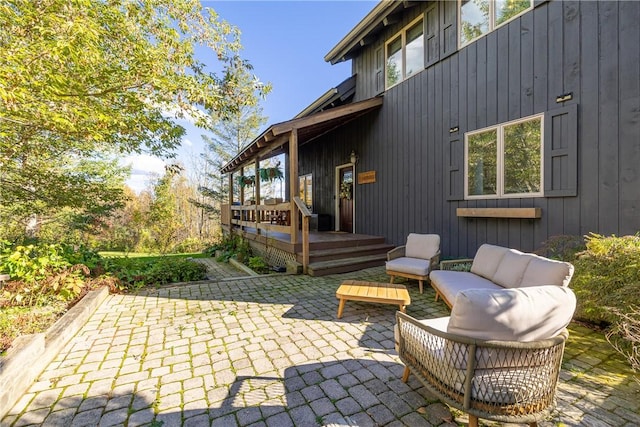 view of patio / terrace with an outdoor living space and a deck