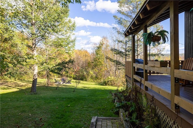 view of yard with a wooden deck