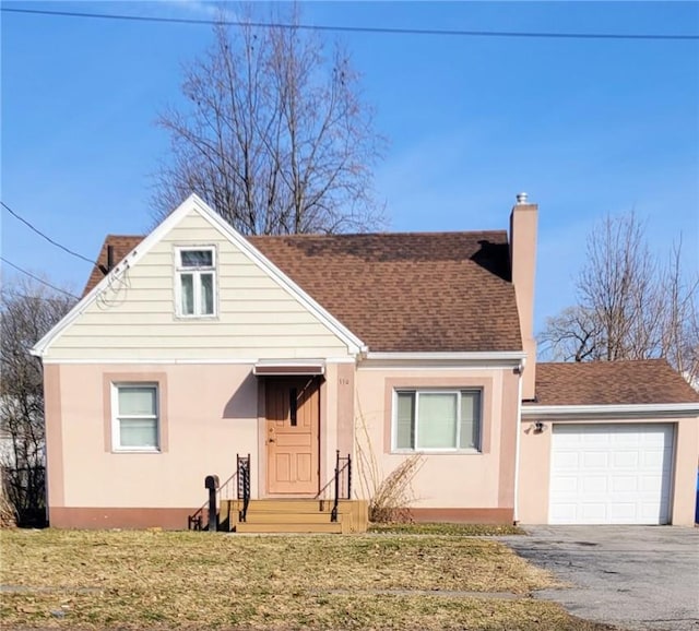 bungalow-style home with aphalt driveway, stucco siding, a chimney, and roof with shingles