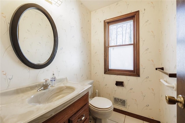 bathroom featuring visible vents, toilet, wallpapered walls, and vanity