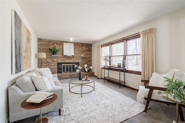 carpeted living room with a brick fireplace, a textured ceiling, and baseboards