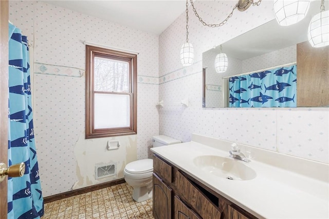 bathroom with visible vents, toilet, wallpapered walls, and vanity