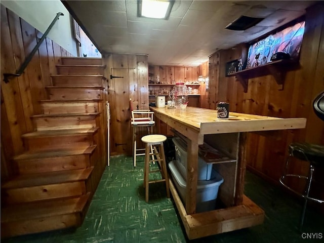 bar with wooden walls and stairs