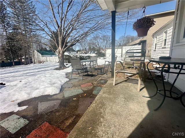 view of patio with outdoor dining area and a fenced backyard