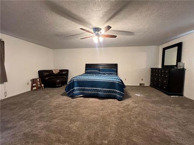 carpeted bedroom with a textured ceiling and ceiling fan