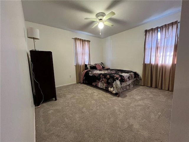 carpeted bedroom featuring a ceiling fan