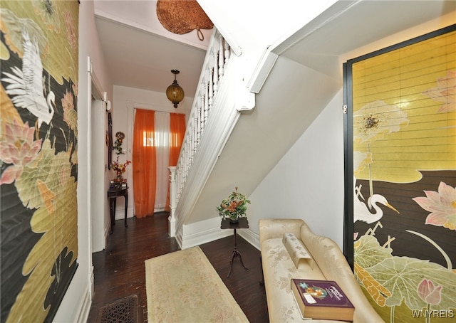 living room with stairway, baseboards, and wood finished floors