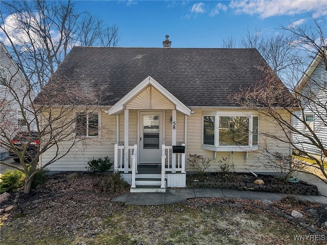 view of front of home featuring roof with shingles