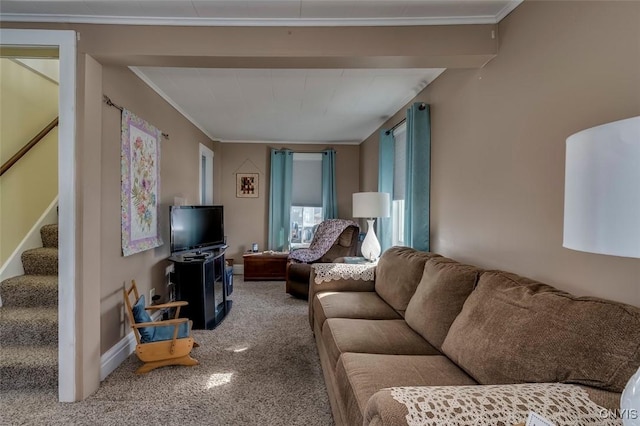 living area featuring stairs, crown molding, and baseboards