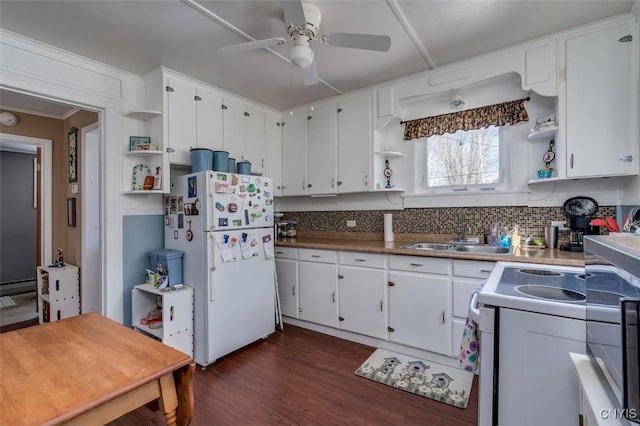 kitchen featuring a sink, white appliances, decorative backsplash, and open shelves