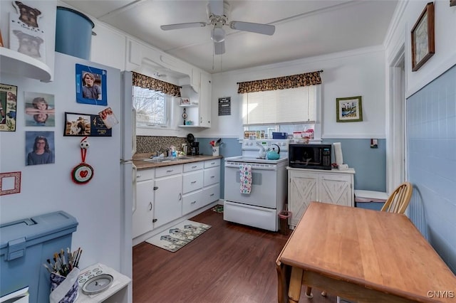 kitchen featuring dark wood-style floors, a ceiling fan, white cabinets, electric stove, and black microwave