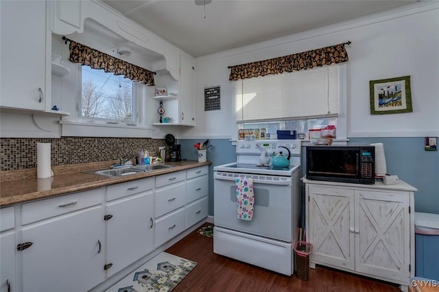 kitchen featuring electric range, a sink, dark wood finished floors, white cabinets, and black microwave