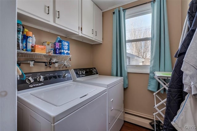 laundry room featuring a baseboard radiator, cabinet space, and independent washer and dryer