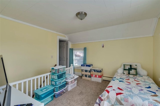 carpeted bedroom with a baseboard radiator, crown molding, and vaulted ceiling