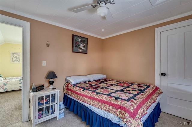 bedroom featuring light colored carpet and ceiling fan