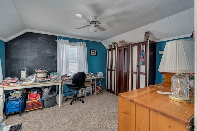 carpeted office with lofted ceiling and ceiling fan