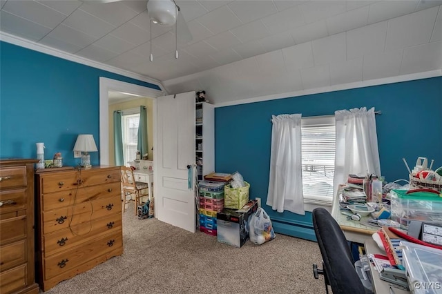 carpeted office with crown molding and vaulted ceiling