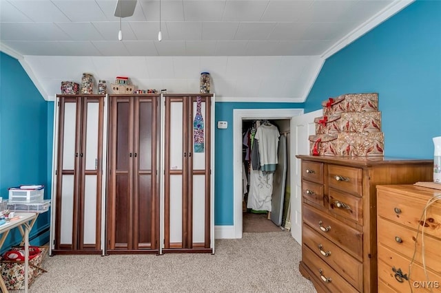 bedroom with lofted ceiling and light carpet