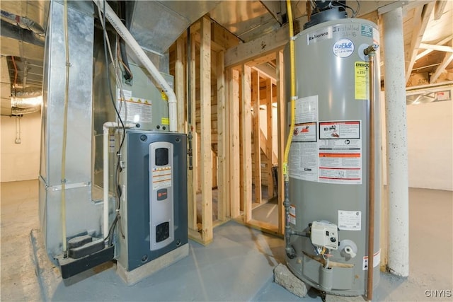 utility room with heating unit and gas water heater