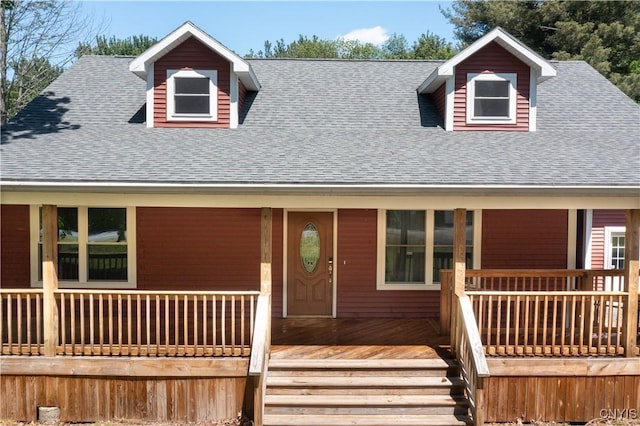 view of front of house with a porch and roof with shingles