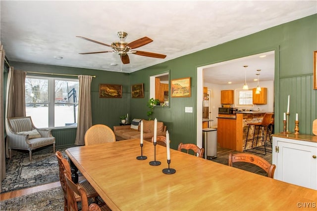 dining room featuring ceiling fan and wood finished floors